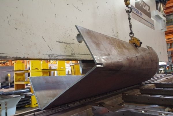 Heavy steel pressing inside a warehouse